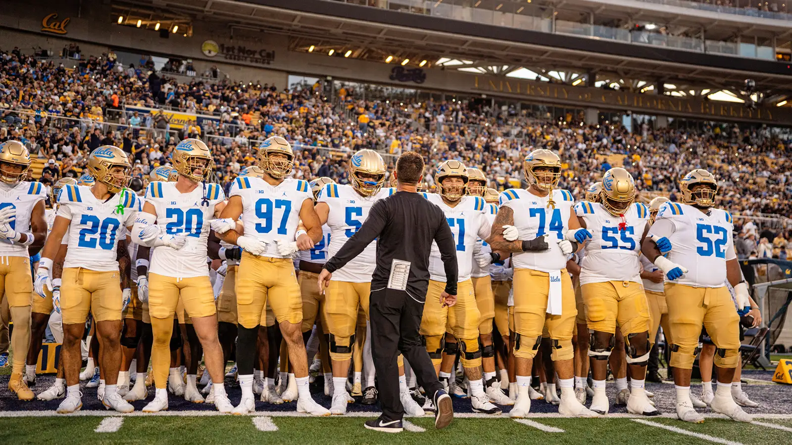 Coach Chesney faces his team before the run out to the field against California