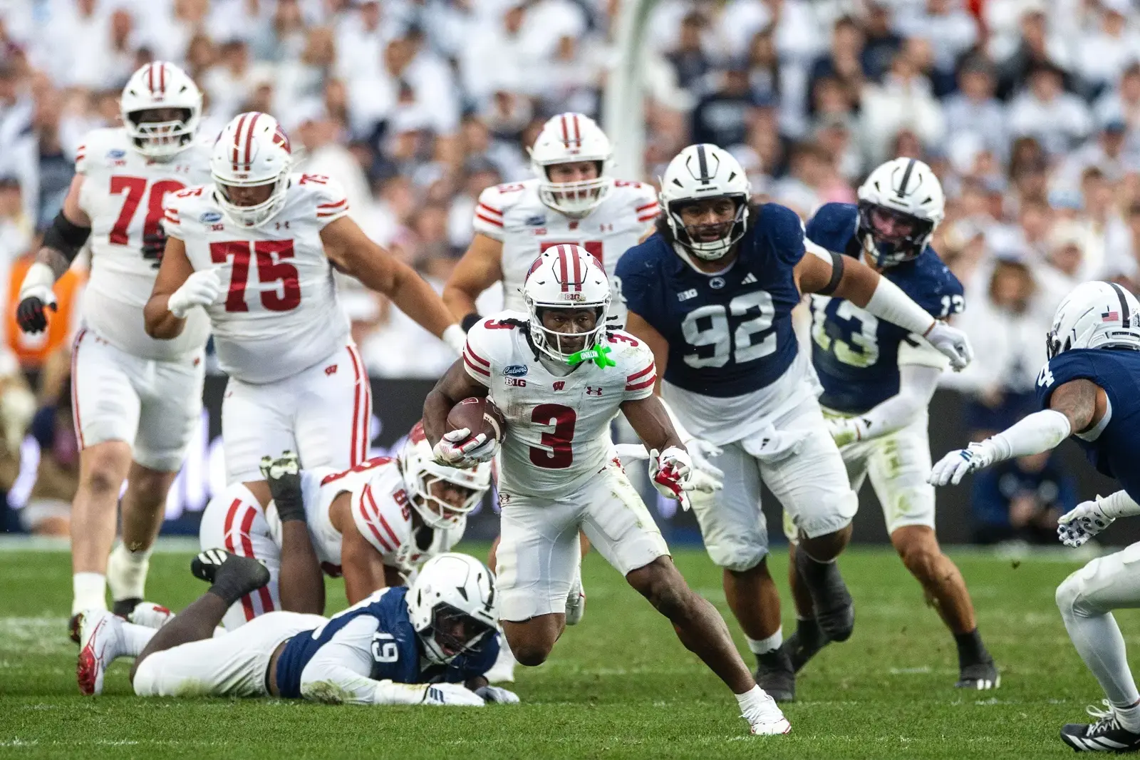 Abu Sama III (3) runs the ball against Penn State